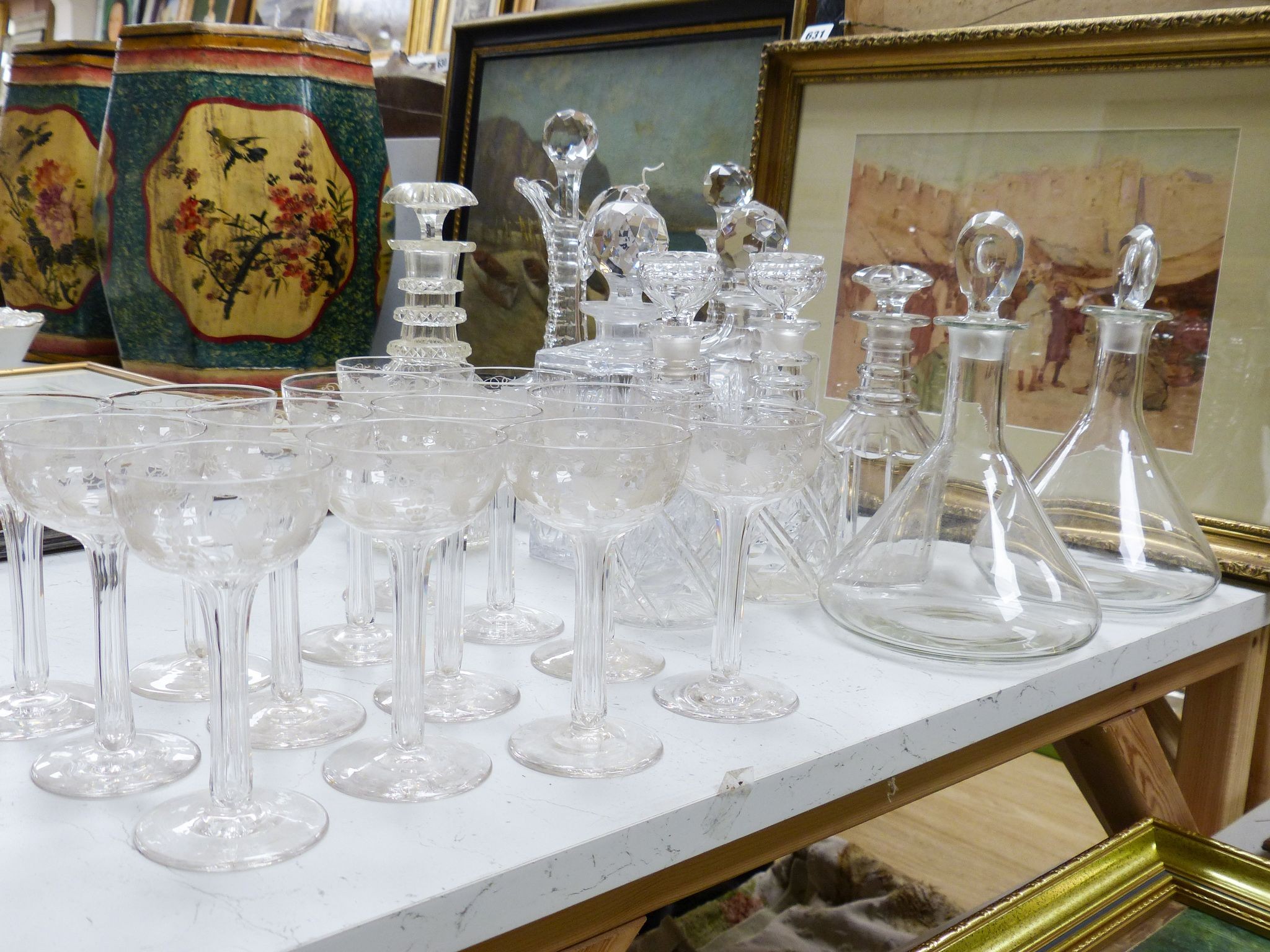 A Victorian diamond cut claret jug and decanter, assorted other decanters and champagne flutes